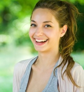'woman smiling after wisdom tooth removal'
