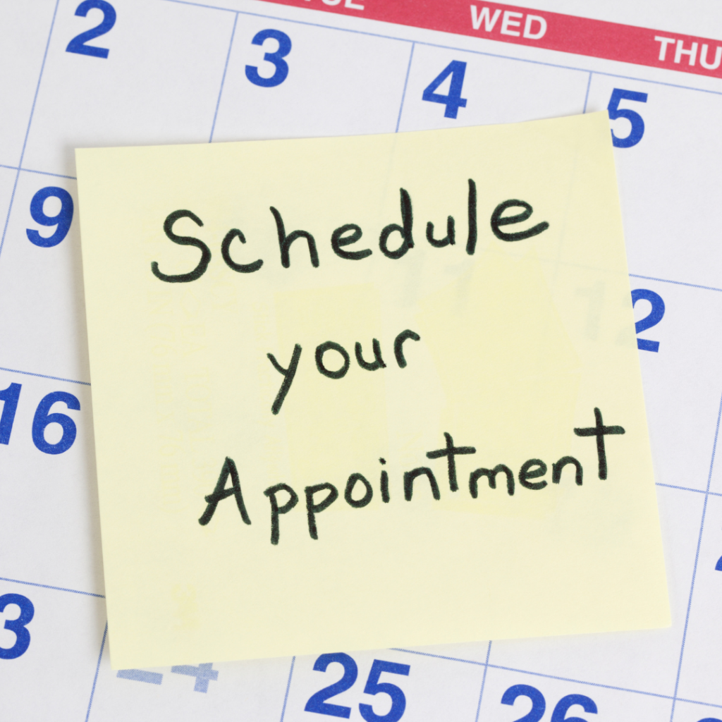 Schedule an appointment reminder on a sticky note on a calendar.