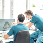 Dental professionals working with digital workflows