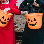 Trick-or-Treating with jack-o-lantern buckets