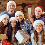 Family smiling with presents on Christmas