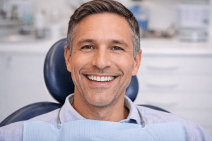 White male dental patient smiling